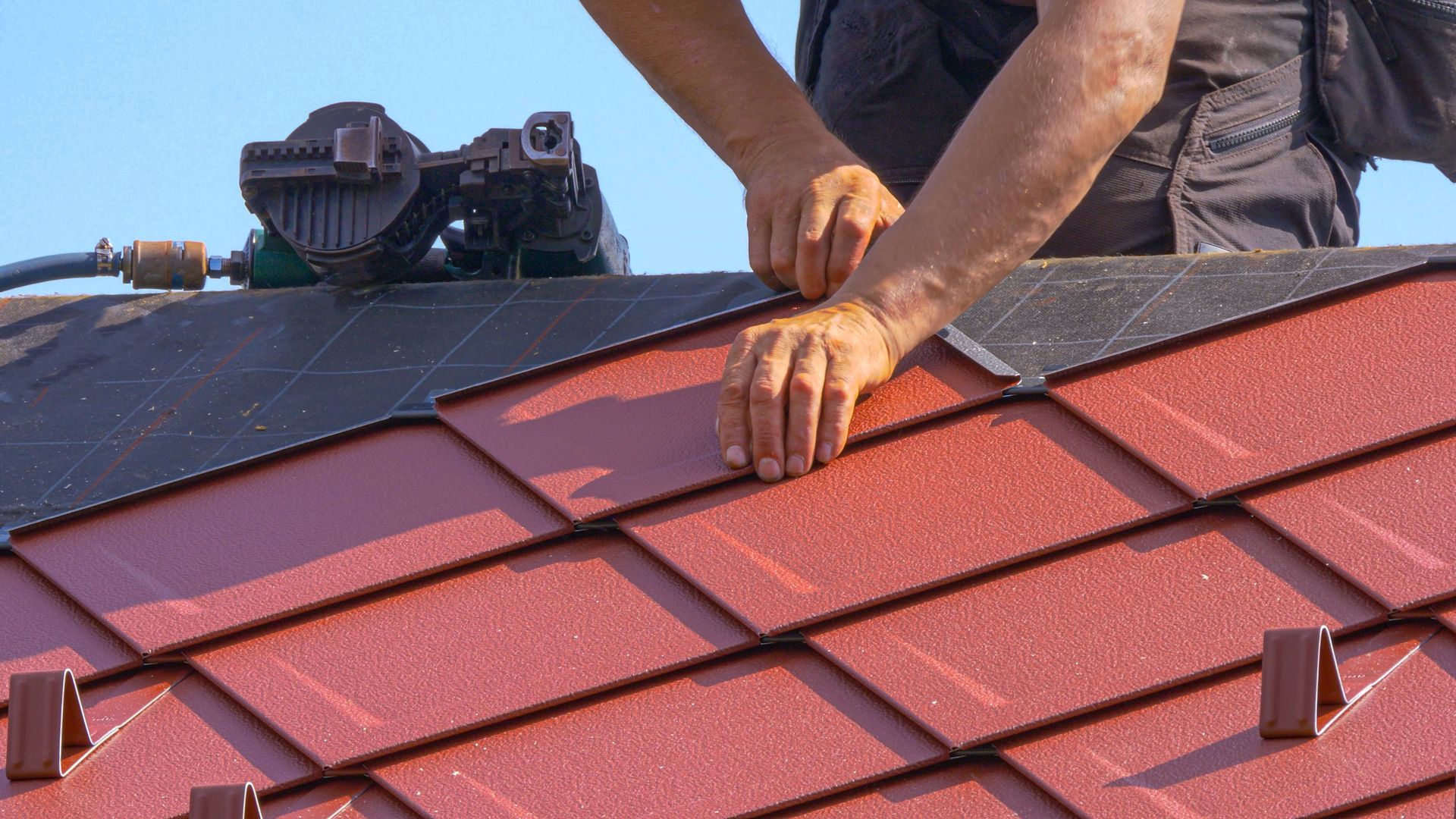 Laying Red Metal Roof