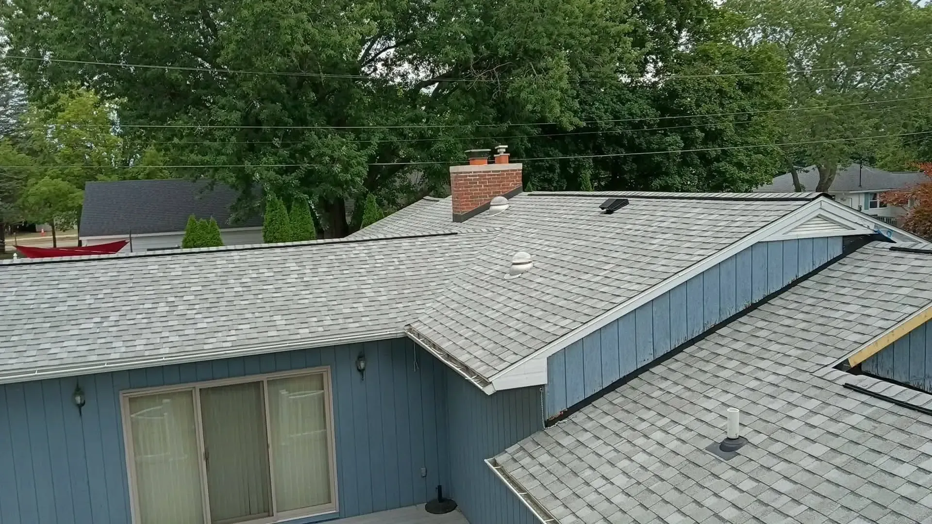 Asphalt shingle roofing installation in Grant, MI, color is cobblestone gray